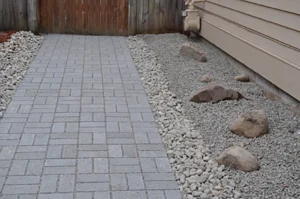 Paved pathway with gravel and rocks.