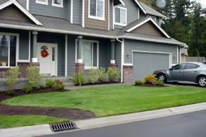 Suburban house with car in driveway.