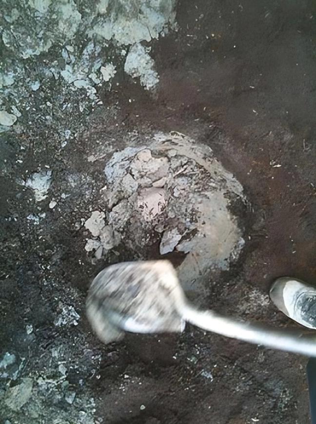 Digging a hole in rocky ground.