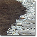 Soil and gravel landscaping detail.